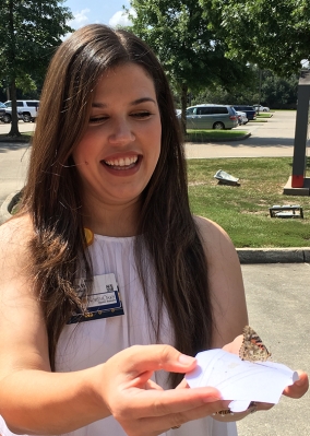 Jessica Wilkes participates in the butterfly release culminating the Memorial Service Aug. 19.